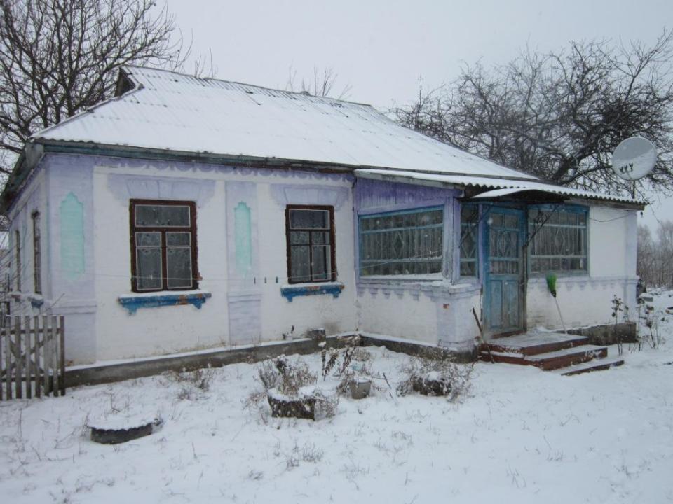 Житловий будинок з надвірними будівлями та спорудами загальною площею 63,8 кв.м., що знаходиться за адресою: Черкаська обл., Жашківський р-н, с. Павлівка, вул. Шевченка, 19