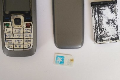 Мобільний телефон "Nokia-2610", ІМЕІ:352771/01/663709/0, з батареєю живлення та сім-карткою мобільного оператора "Київстар", має потертості та подряпини, б/в