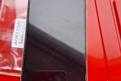 Конфісковане майно за рішенням суду: мобільний телефон торговельної марки «Xiaomi» моделі «Rеdmi 1», білого кольору, б/в