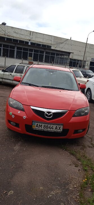 ½ частини автомобіля марки MAZDA 3, 2007 року випуску, червоного кольору, номер кузова JMZBK12Z581596103, реєстраційний номер АМ8844АХ