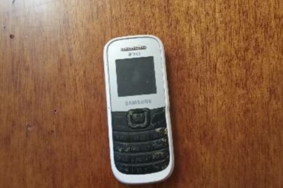 Мобільний телефон марки "SAMSUNG" модель GT-Е 1080W, сіро білого кольору, б/в