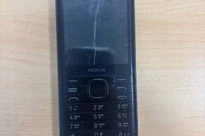 Конфісковане майно за рішенням суду: мобільний телефон марки "Nokia", б/в, ІМЕІ 1 - 356946110099888,  ІМЕІ 2 -356946110584889