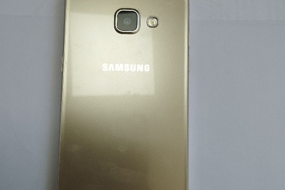 Конфіскація майна згідно ухвали суду: мобільний телефон марки "Samsung SM-A510F" із зарядним пристроєм, б/в