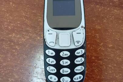 Конфіскація майна згідно ухвали суду: мобільний телефон марки «MiniPhone» (imei1: відсутній), б/в