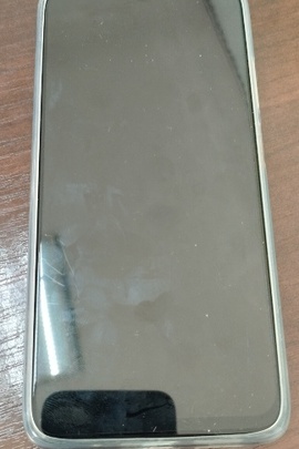 Конфісковане майно за рішенням суду: коробка з мобільним телефоном темно-синього кольору марки «Redmi-9T», серійний номер: 31175/81TB04294, IMEI: 860664059662447, 860664059662454, нове