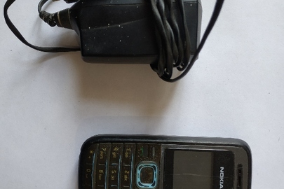 Мобільний телефон марки "Nokia 1208" із зарядним пристроєм марки "Nokia"