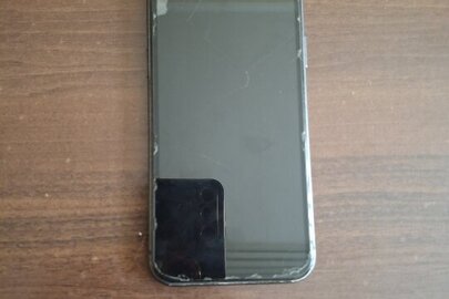 Конфіскація майна за ухвалою суду: Мобільний телефон марки Iphone 11, IMEI 356861119148356,  IMEI 356861119065915, із сім картою, до якої прив'язаний номер мобільного телефону, б/в 