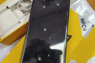 Майно конфісковане за рішенням суду: коробка з написом "Realme С 51" з мобільним телефоном марки "Realme" моделі "RMX3830" ІМЕІ 1.865001060728658, ІМЕІ 2.865001060728641, USB- кабель та блок живлення; б.в.