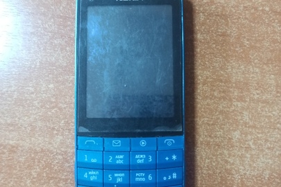 Мобільний телефон " Nokia" в корпусі блакитного кольору, б\в, в неробочому стані