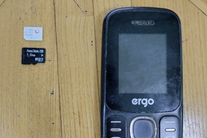 Конфісковане майно за рішенням суду: мобільний телефон марки "Ergo" моделі В184, чорного кольору, із сім - картою мобільного оператора  «Vodafone» та флеш-накопичувачем micro SD 8 Gb, б/в