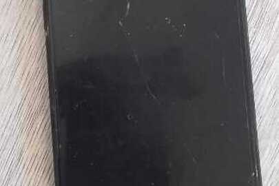 Конфісковане майно за рішенням суду: мобільний телефон марки "Samsung", з карткою абонентського номеру Київстар, зарядний пристрій, б/в.