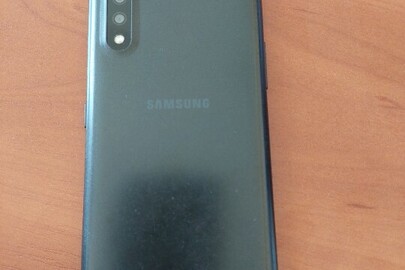 Конфіскація майна за рішенням суду, а саме:  мобільний телефон марки «Samsung», б/в