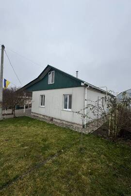 Житловий будинок заг. пл. 98.2 кв.м., жит. пл. 48.5 кв.м., та земельна ділянка, заг. пл. 0.3775 га, К/Н: 7120983000:01:001:0318, за адресою: Черкаська обл., Уманський р., с. Конельська Попівка, вул. Молодіжна, буд. 60