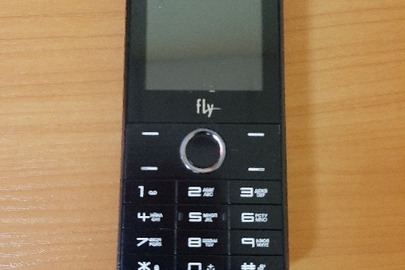 Мобільний телефон торгової марки "Fly" з IMEI: 352474086555027