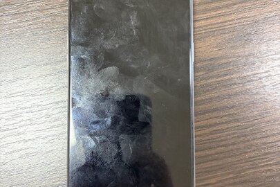 Конфісковане майно за рішенням суду: мобільний телефон білого кольору, марки: Realme 61, моделі: RMX 2040, б/в