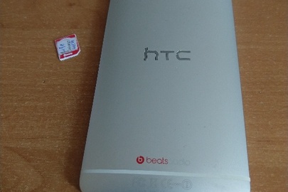 Конфісковане за рішенням суду майно ,  мобільний телефон  б/в HTC ONE M7 Silver та сім карта оператора Life б/в