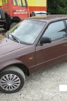 Транспортний засіб марки MAZDA 626, 1990 року випуску, номер кузова JMZGD143201579575, реєстраційний номер ВХ7065СК, коричневого кольору