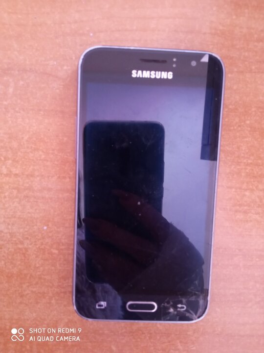 Мобільний телефон марки “SAMSUNG”  моделі SM-J120F/DS IMEI:355323/07/900585/3, IMEI:355324/07/900585/1, чорного кольору, б/в, 1 шт.