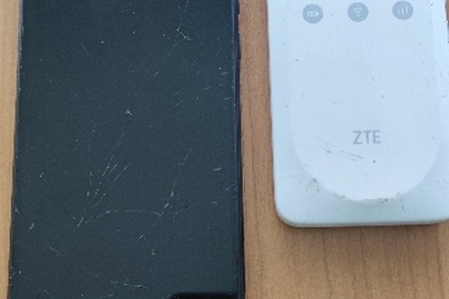 Конфісковане майно за рішенням суду: мобільний телефон марки «Redmi» модель 9А, чорного кольору, та Wi-Fі модем «ZТЕ», модедь MF395, білого кольору, з сім картою "Київстар", б/в