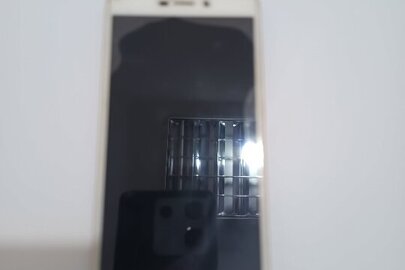 Конфісковане майно за рішенням суду: мобільний телефон марки Xiaomi 4glite, бежевого кольору, 1 шт., б/в