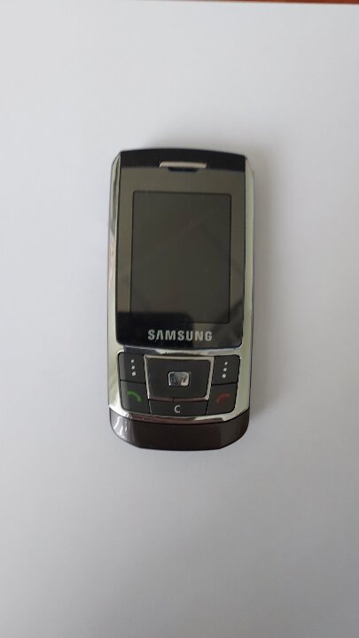 Мобільний телефон марки “Samsung” SGH-D 900і, бувший у використанні