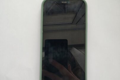 Конфісковане майно за рішенням суду: мобільний телефон "ІPHONE-12" (IMEI 354696403676437) із силіконовим чохлом бірюзового кольору з сім-картою абонементського номеру телефону, бувший у використанні