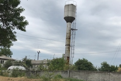 Водонапірна башта, інв. №28, об"єм 25 куб.м, висота 24 м, рік введення в дію - 1993 р., що розташована за адресою: Дніпропетровська обл., Царичанський р., смт. Царичанка, вул. Мостова, б/н