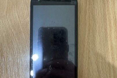 Конфіскація за вироком суду: мобільний телефон марки "Pixi ALCATEL one touch", стан: подряпини на корпусі, маються сліди використання
