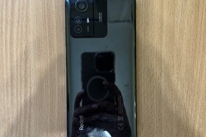 Конфіскація за вироком суду: мобільний телефон марки Redmi 12s IMEI 864871066830760, стан: подряпини на корпусі, екран пошкоджений, маються сліди використання