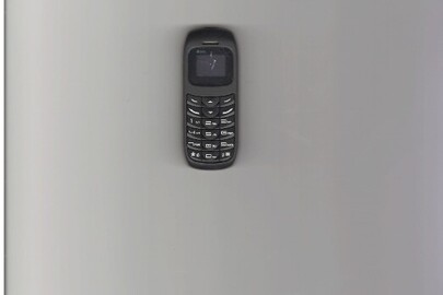 Мобільний телефон марки "BM70" чорного кольору IMEI 1:355515268876032, 2:355515268876040 з батареєю живлення та сім-карткою мобільного оператора "Kyivstar" без зарядного пристрою до нього, б/в