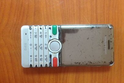 Телефон стільникового зв'язку марки "Соні Еріксон" 8312 світло-сірого кольору із сім-картою