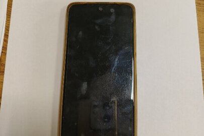 Конфіскація майна за ухвалою суду:мобільний телефон марки "Redmi Note 11" IMEI 864154053237533, IMEI 864154053237525 з сім картою оператора мобільного зв'язку ПрАТ "Київстар", б/в