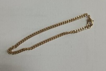 Конфісковане майно за рішенням суду:ланцюжок із недорогоцінного металу,б/в