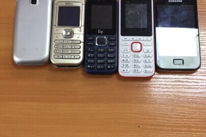 Мобільні телефони в кількості 5 шт., марки «SAMSUNG», «FLY», «BRAVIS», «NОКІА», «SAMSUNG», б/в