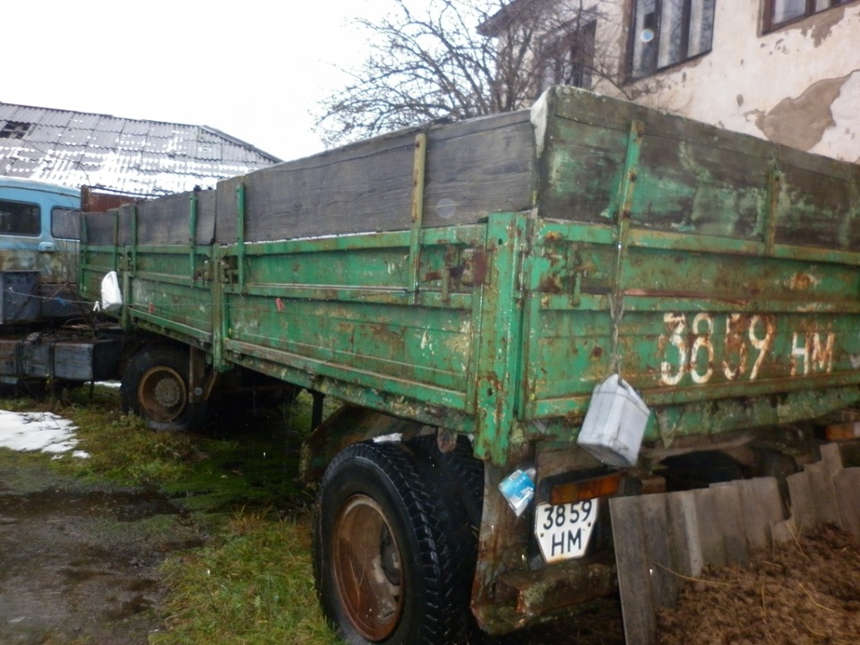 Напівпричіп бортовий -Е, марки ОДАЗ, модель 9357, 1993 року випуску, ДНЗ 3859 НМ, рама № 032747, зеленого кольору