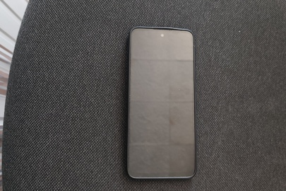 Конфіскація майна за вироком суду:мобільний телефон моделі "Redmi" блакитного (голубого) кольору у чохлі чорного кольору б/в