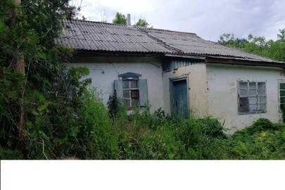 Житловий будинок з господарськими будівлями загальною площею 54.8 кв.м. за адресою: Полтавська обл., Глобинський р-н, с. Манжелія, вул. Зарічна, буд. 27