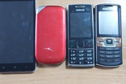 Конфіскація майна за рішенням суду:мобільні телефони 4 шт., б/в