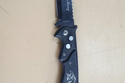 Конфіскація майна за рішенням суду: розкладний ніж чорного кольору, б/в