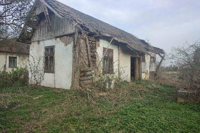 Нежитлова будівля адмінбудинку літ. А-1, загальною площею 48,4 кв.м., господарська будівля літ. Б-1, загальною площею 93,4 кв.м. та вбиральня літ. В, за адресою Львівська область, Стрийський район, смт. Журавно, вулиця Шухевича, будинок 11