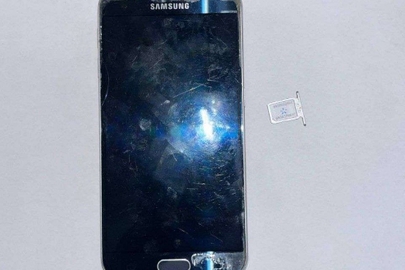 Конфіскація майна за рішенням суду: мобільний телефон ТМ "SAMSUNG" ІМЕІ 353а560082298437/02, SN RF8HA26WXKX,Х з сім-картою KYIVSTAR, стан б/в