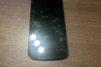 Конфісковане майно: мобільний телефон марки «Fly» моделі «ВL7203» в корпусі чорно-сірого кольору Іmei №1: 8684550179442837 , Іmei №1: 868455018089935, б/в 