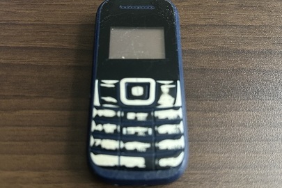 Конфісковане майно: мобільний телефон марки "NOMI" в корпусі чорно-синього кольору, IMEI № 1: 351851110400155; № 2: 351851110400163, б/в