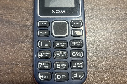 Конфісковане майно за постановою: мобільний телефон марки "NOMI" модель I 1441 в корпусі синього кольору, б/в