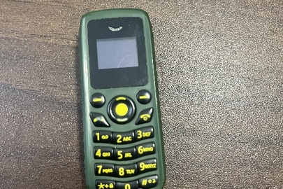 Конфісковане майно за постановою: мобільний телефон марки "Mini Phone" модель B 25 в корпусі зеленого кольору, б/в