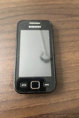 Конфісковане майно за постановою: мобільний телефон марки "SAMSUNG" модель GT-S5250 в корпусі чорного кольору, б/в