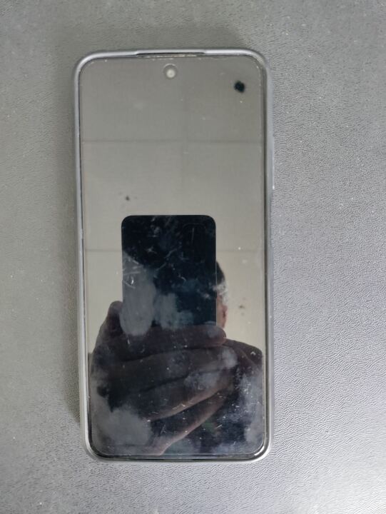 Мобільний телефон в чохлі чорного кольору марки «Redmi» ІМЕІ 1 - 860164057517289/01, ІМЕІ 2 - 860144057517297/01, ICCID1 - 8938003992806439608, серійний номер - 35251/SIZS02545, бувший у використанні