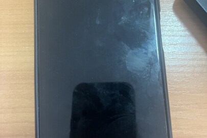 Конфісковане майно за рішенням суду:  мобільний телефон марки GalaxyA03s моделі SM-A037F/DS, в корпусі сірого кольору, ІМЕІ 1) 350060035625672/01 , 2) 357438815625679/01, б/в