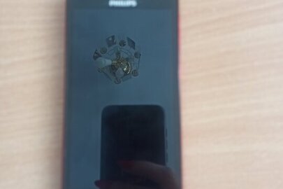 Конфісковане майно: мобільний телефон марки 'PHILIPS' модель Xenium V377 в корпусі червоно-чорного кольору, б/в