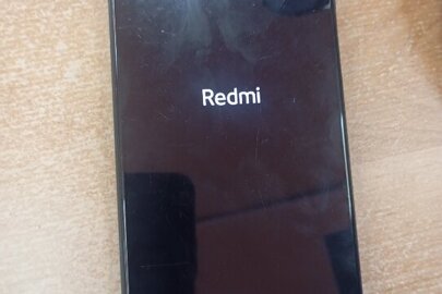 Конфісковане майно за рішенням суду:мобільний телефон марки Redmi Note9Pro, imei: 86550605621929800, imei: 8655060556219306/00, б/в